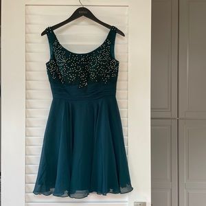Hand beaded teal dress.